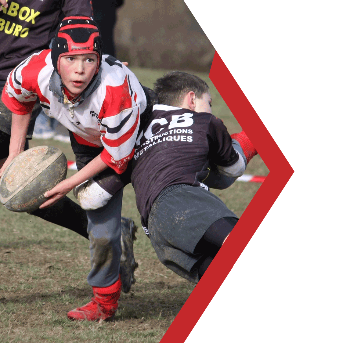 Home header image of Kids playing rugby, boy passing rugby ball while being tackled with chevron border